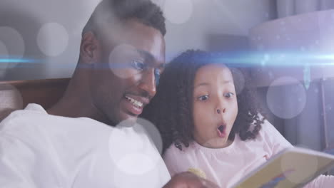animación de puntos de luz sobre un feliz padre afroamericano leyendo un libro con su hija