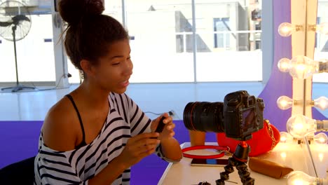 model applying make up in photo studio 4k
