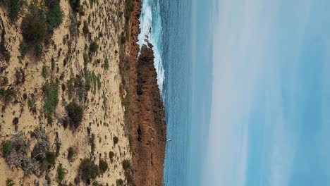 the almograve beach with black basalt rocks in alentejo coast, portugal