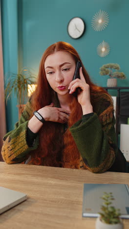 nervous stressed woman manager quarrelling smartphone call online talking aggressively at office