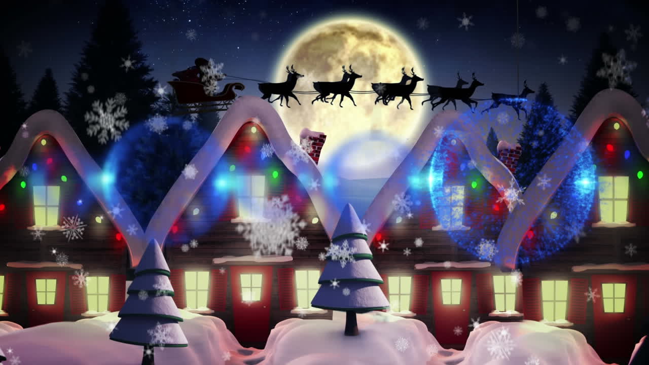 파란색 장식품이 매달려 있고 눈송이가 겨울 풍경의 여러 집 위에 떨어지고 있습니다.