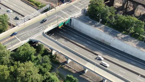 Aerial,-Traffic-on-the-highway-near-between-the-river-and-railroad