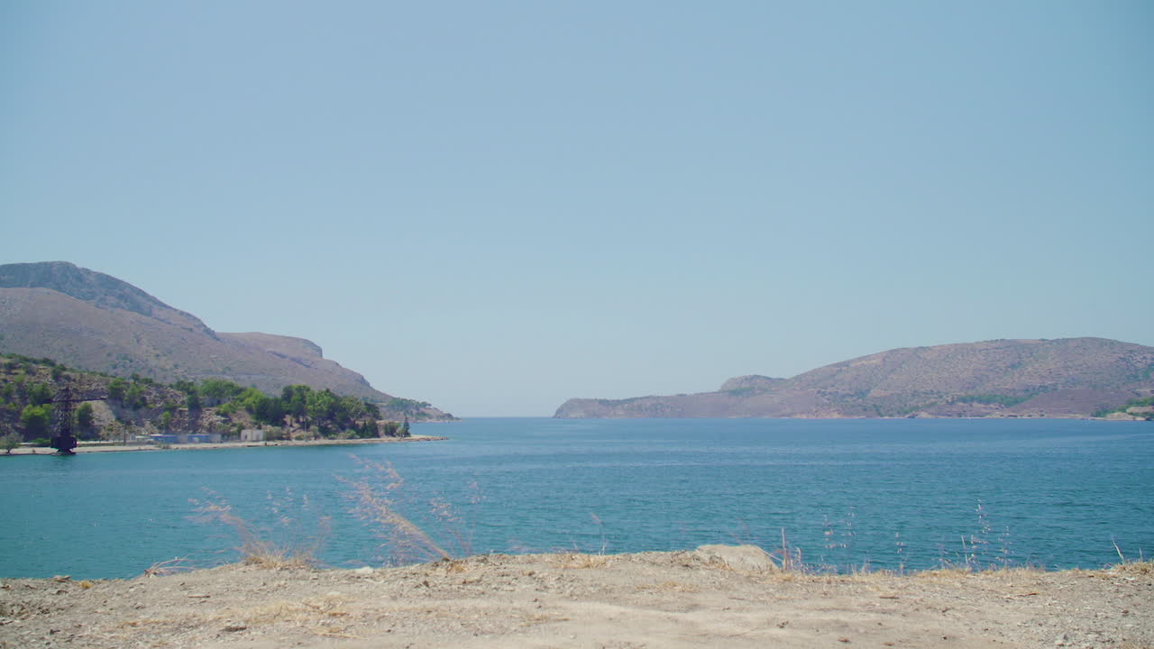 Panning shot of a bay on the coast of Leros, Greece