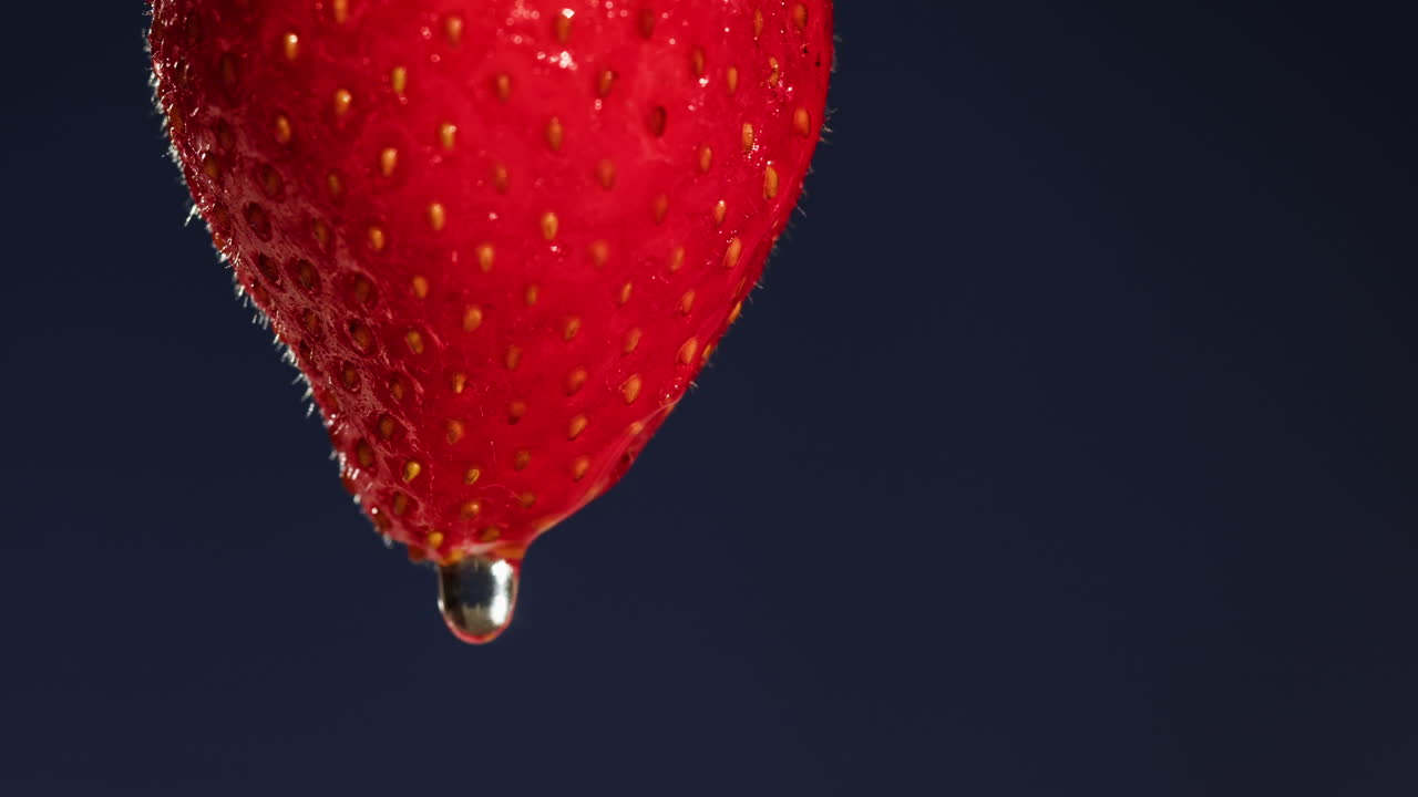 Close-up of a Droplet on a Strawberry