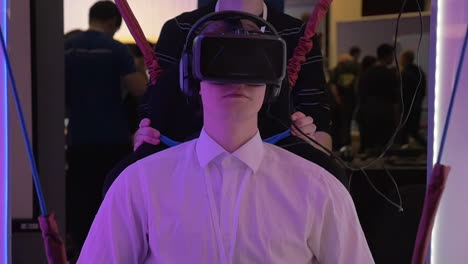 man trying virtual reality attraction