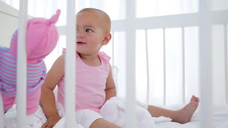 baby girl playing with dolls