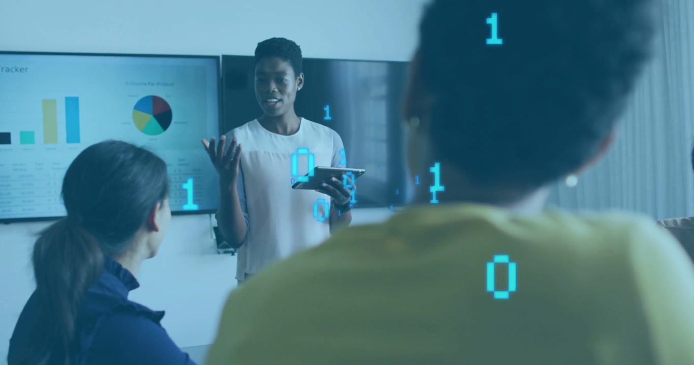 Presenter tapping tablet, causing binary digits to float while gesturing and explaining charts