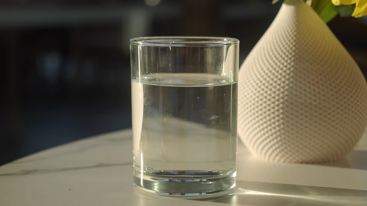 Glass of water and vase