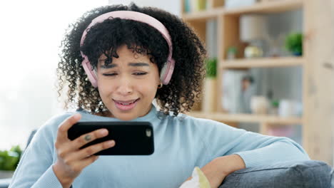 trendy girl holding a phone laughing at funny
