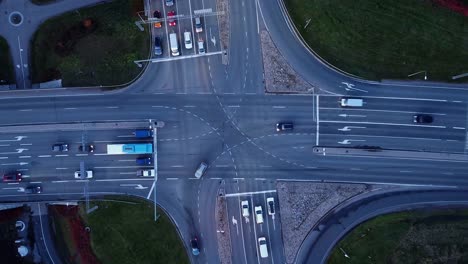 Overhead-view:-Painted-lines-guide-car-traffic-in-highway-intersection