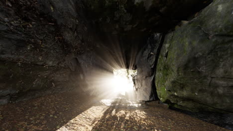 sunlight filtering through a rocky cave