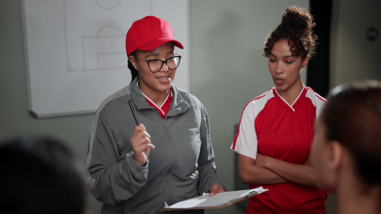 Soccer team meeting with coach