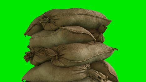 sandbags-for-flood-defense-or-military-use-on-green-chromakey-background