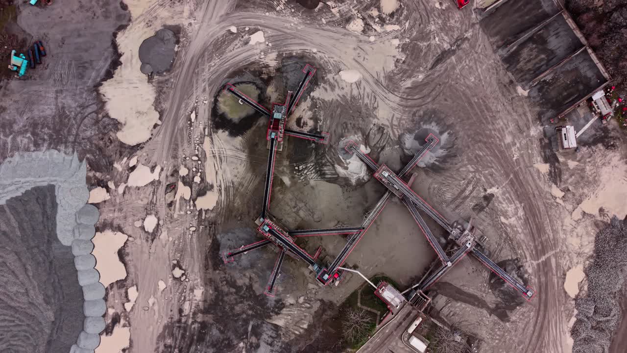 Granite quarry site with machinery working on extraction process