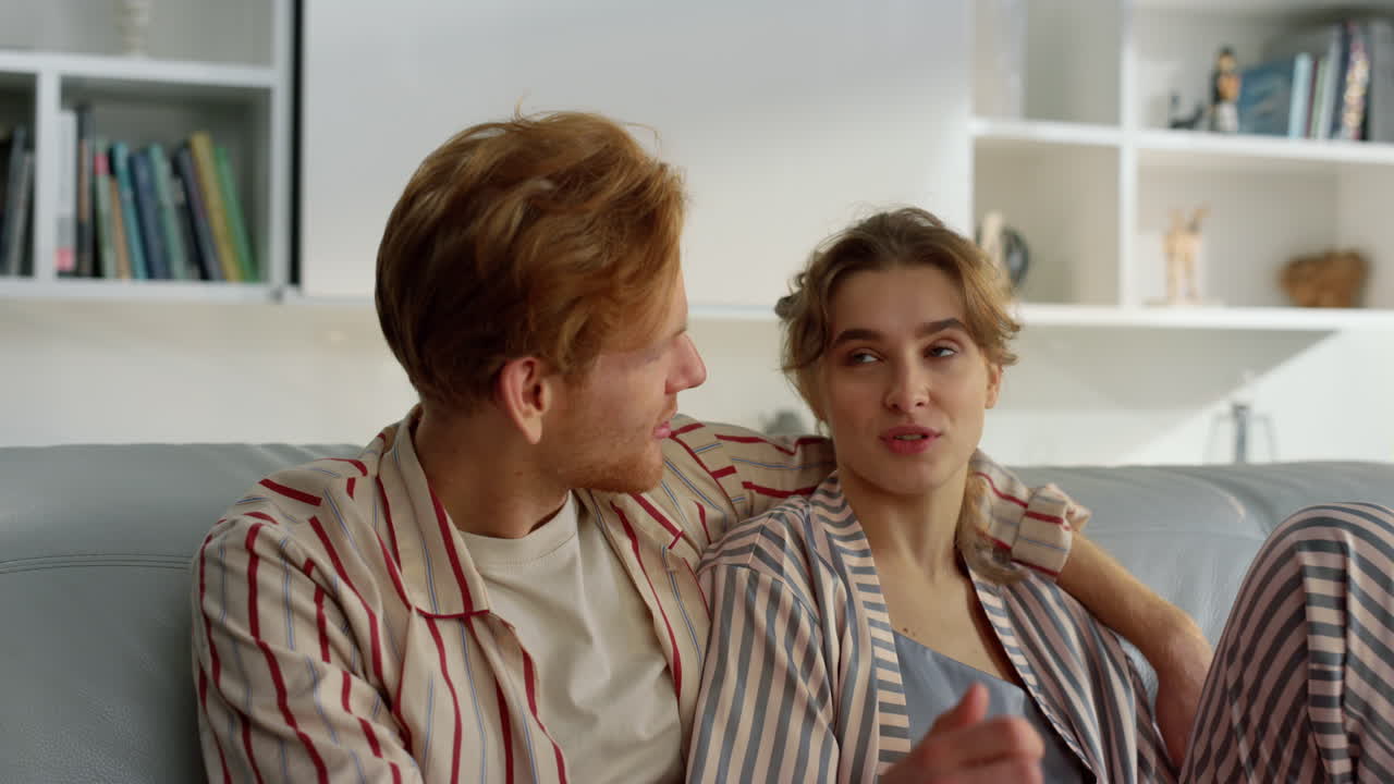 Loving people relaxing sofa together closeup. Happy husband care about wife