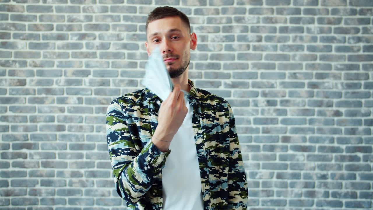 Man playing with money