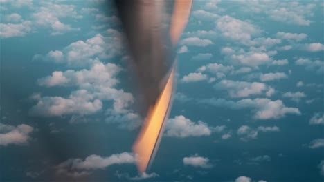 rotating propeller of an aircraft high above the clouds