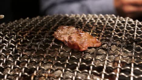 enjoying japanese bbq grilled yakiniku at restaurant in ikebukuro tokyo, japan