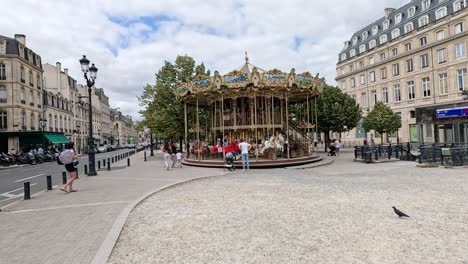 merry-go-round spinning in a bustling city square