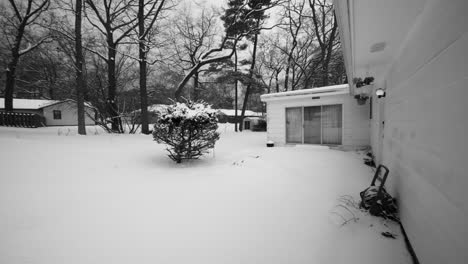 black and white pan away from a house