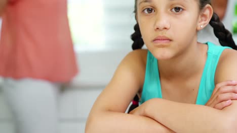 Sad-girl-sitting-at-table-