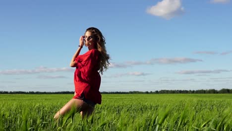 Woman in a red dress in a field