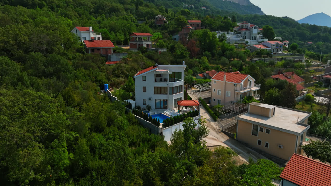 Aerial view around luxury villas in the hills of Montenegro, sunny summer day