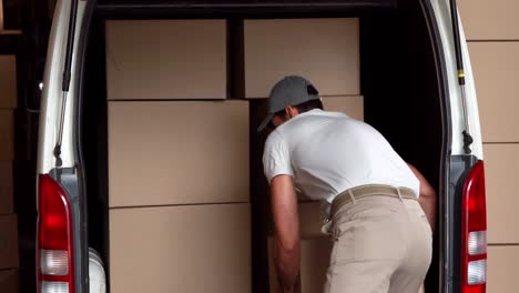 delivery driver unloading his van