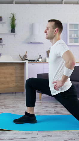warm-up before sports. warm-up at home on the mat before sports. vertical video