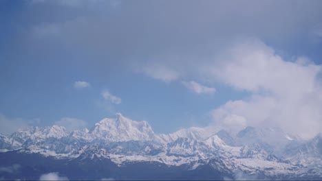 cloud time-lapse over a snow peek mountain