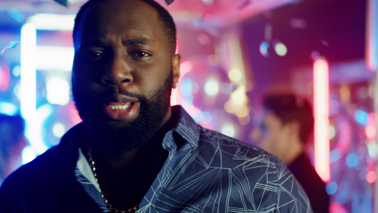 African american man having fun at party. Active male person dancing in club