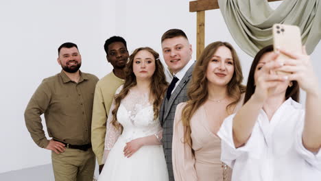 wedding couple and friends at the altar