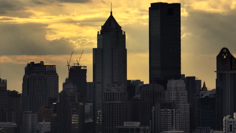 high rise buildings at sunset in the city capital of bangkok, thailand. static shot