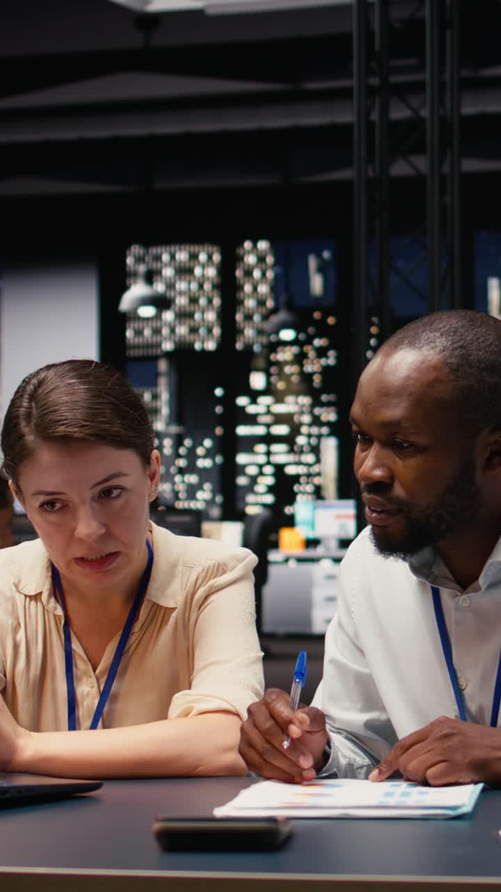Vertical Video Multiethnic coworkers collaborating in a corporate office
