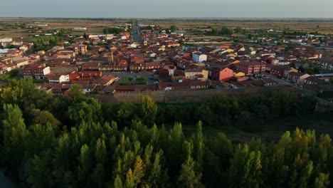 drone footage of sunset over small medieval village in the north of spain