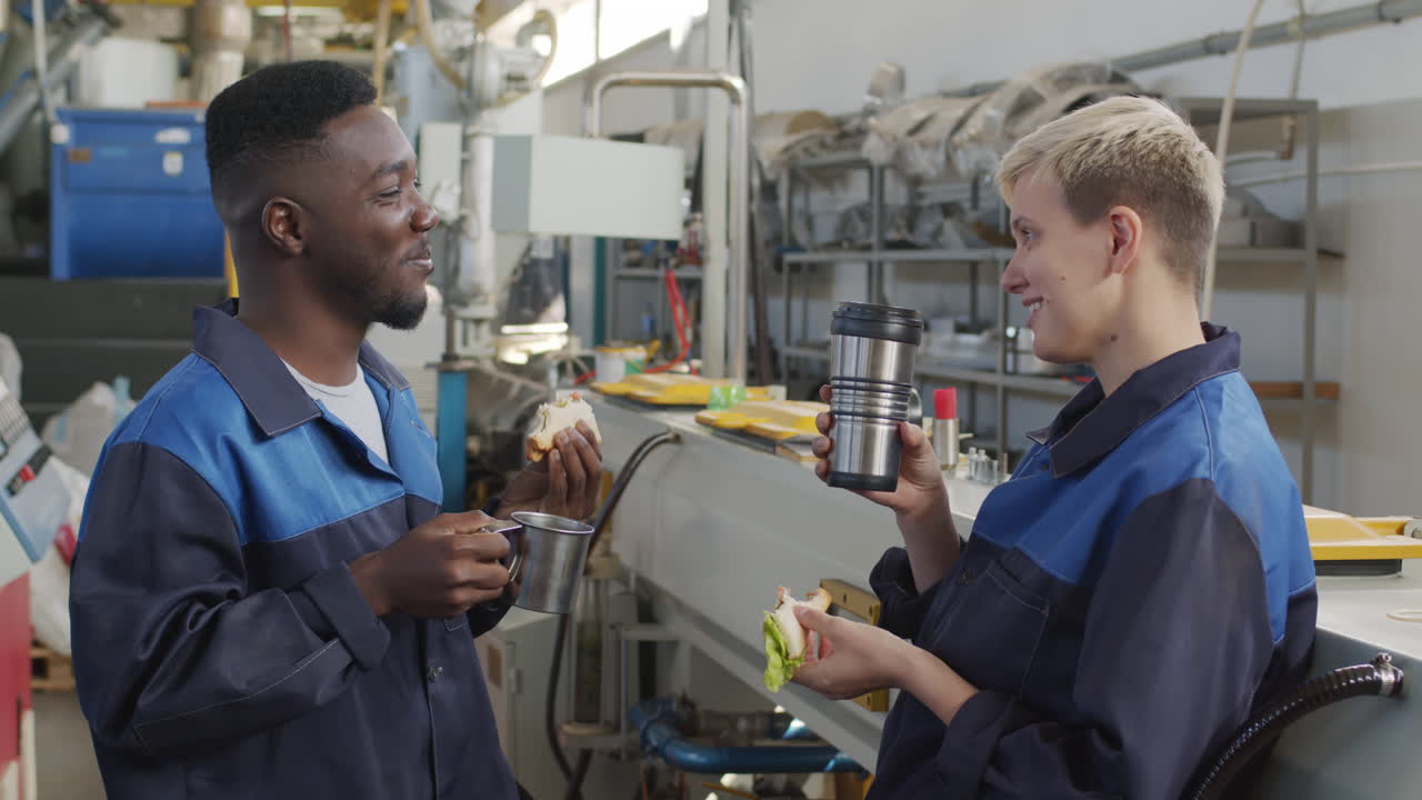 Cheerful Factory Workers Enjoying Lunch Break