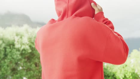 slow motion video of african american man wearing red hoodie with copy space