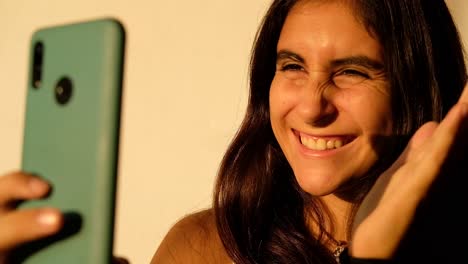 close-up-of-natural-brown-hair-girl-talking-on-the-phone-camera