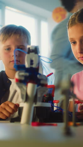 kids building a robot arm