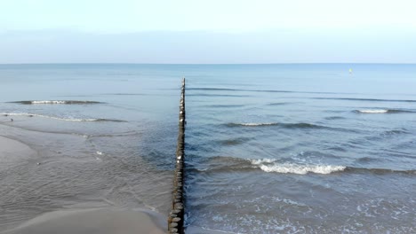 Aerial-shot-of-sandy-beach-in-Ustka-in-winter