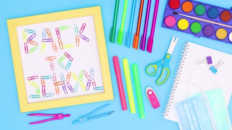 school stationery move around yellow frame with back to school title on blue theme. stop motion