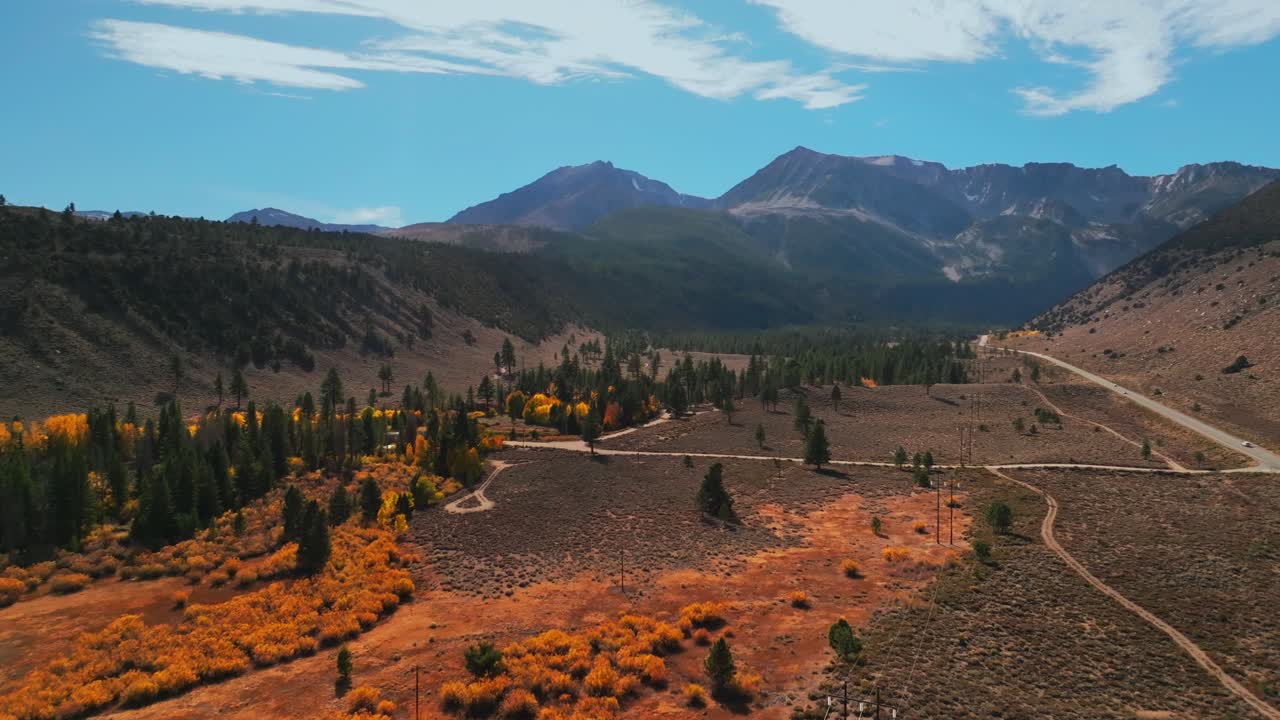 West Portal Entrance Lee Vining Tioga Pass Road Yosemite National Park Ansel Adams Wilderness Big Oak Flat California aerial drone fall autumn yellow orange Aspen Trees blue skies clouds cars circle