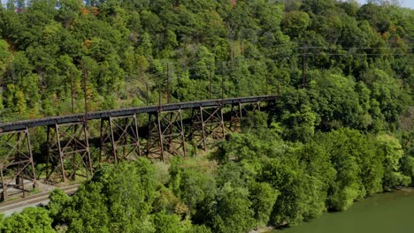 Abandoned-Trestle-Bridge-near-Susquehanna-River-Aerial-in-Forest