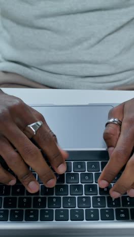 person typing on a laptop