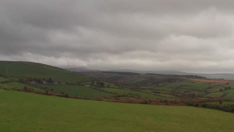 tracking aerial of fast moving clouds over a lush green ireland countryside