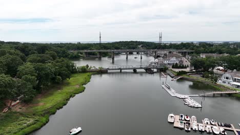 a high angle aerial view of the saugatuck river in westport, connecticut on a cloudy day