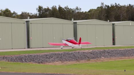 light airplane taking off from a grassy airfield