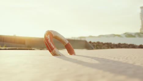 Lifebuoy-on-the-city-beach-at-sunset