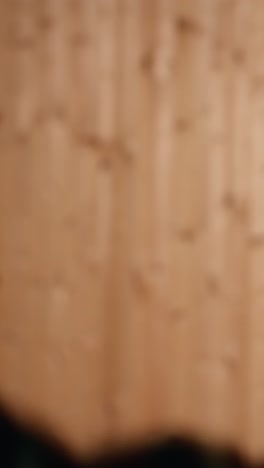 vertical video man holding gun enjoying recreational indoor shooting, close up