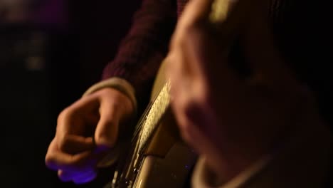 strumming a guitar chord in slow motion